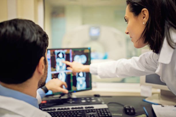 doctors are working with ct scan in hospital